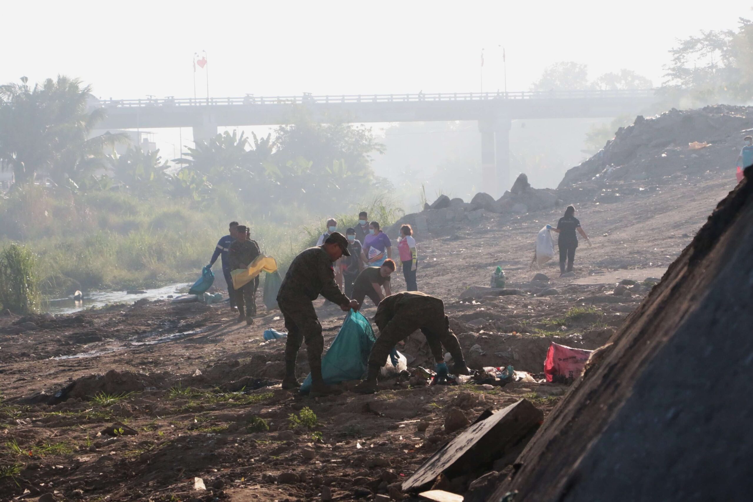 Volunteers continue the seemingly daunting task of cleaning up the Abacan River of plastics and waste a year after the Abacan River Cleanup Drive was started on Earth Day by the Balibago Waterworks System Inc. to restore the river’s natural beauty and raise environmental awareness in the community.